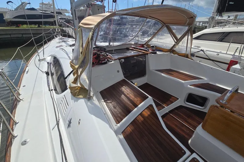 Slide: The Image of 2011 Jeanneau Sun Odyssey 50 DS sailboat with spacious cockpit and wooden seating. - 24