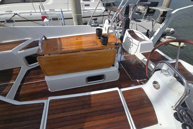 Slide: The Image of Cockpit of 2011 Jeanneau Sun Odyssey 50 DS with wooden accents and dual steering wheels. - 25