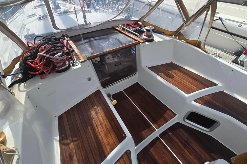 Slide: The Image of Cockpit of 2011 Jeanneau Sun Odyssey 50 DS with teak flooring and rigging ropes. - 26