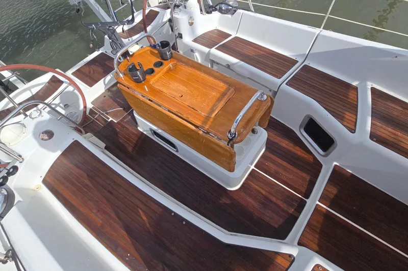 Slide: The Image of Cockpit of 2011 Jeanneau Sun Odyssey 50 DS with wooden seating and steering wheels. - 29
