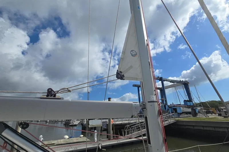 Slide: The Image of Sailboat Jeanneau Sun Odyssey 50 DS, 2011, docked under cloudy sky. - 42