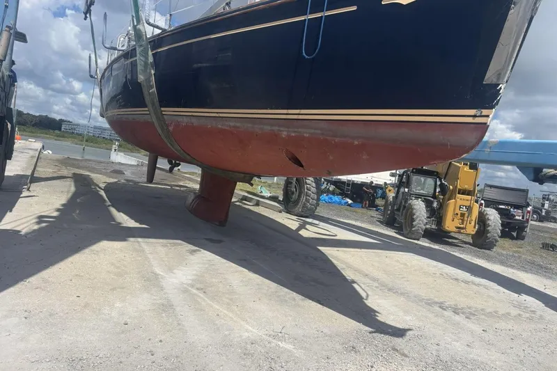 Slide: The Image of 2011 Jeanneau Sun Odyssey 50 DS sailboat being lifted for maintenance. - 5