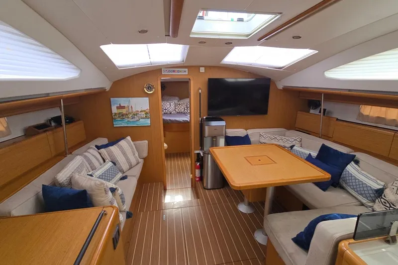 Slide: The Image of Luxurious interior of 2011 Jeanneau Sun Odyssey 50 DS yacht with elegant seating and modern amenities. - 52