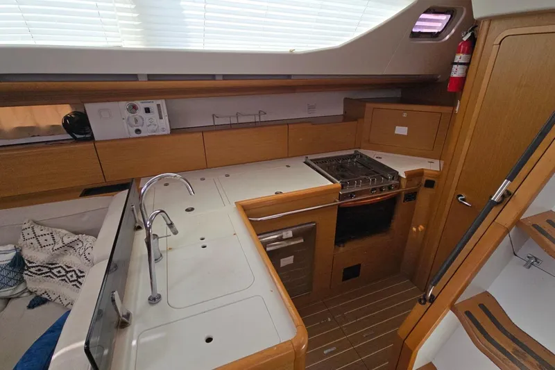 Slide: The Image of Interior of 2011 Jeanneau Sun Odyssey 50 DS yacht kitchen with stove and sink. - 53