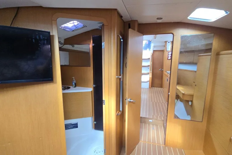 Slide: The Image of Interior of 2011 Jeanneau Sun Odyssey 50 DS yacht with wooden finish and modern amenities. - 64