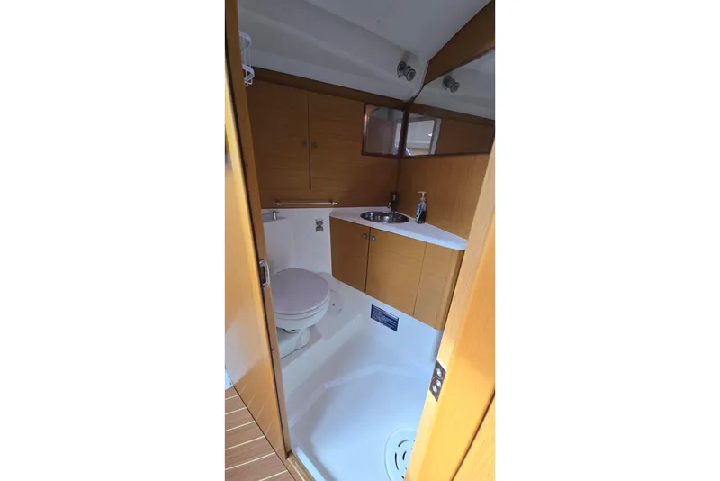 Slide: The Image of Interior of 2011 Jeanneau Sun Odyssey 50 DS yacht bathroom with wooden cabinetry. - 66