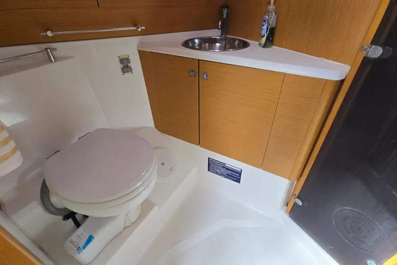 Slide: The Image of Bathroom interior of 2011 Jeanneau Sun Odyssey 50 DS yacht, featuring toilet and sink. - 68