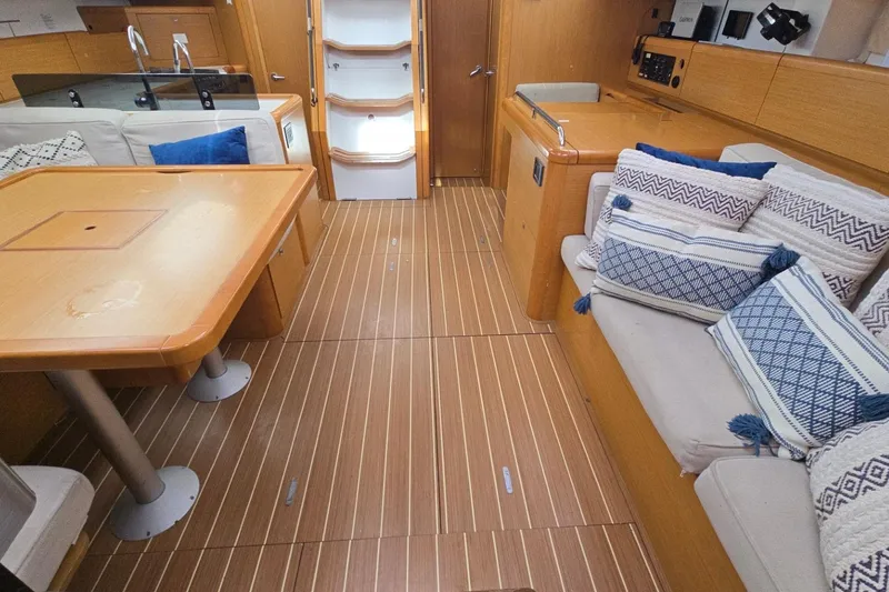 Slide: The Image of Interior of 2011 Jeanneau Sun Odyssey 50 DS yacht with wooden flooring and cozy seating. - 70