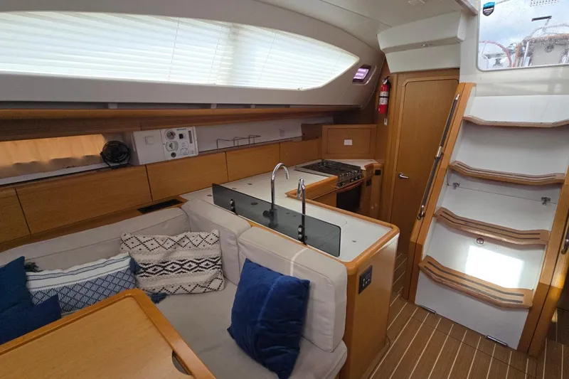 Slide: The Image of Interior of 2011 Jeanneau Sun Odyssey 50 DS yacht with modern kitchen and seating area. - 71