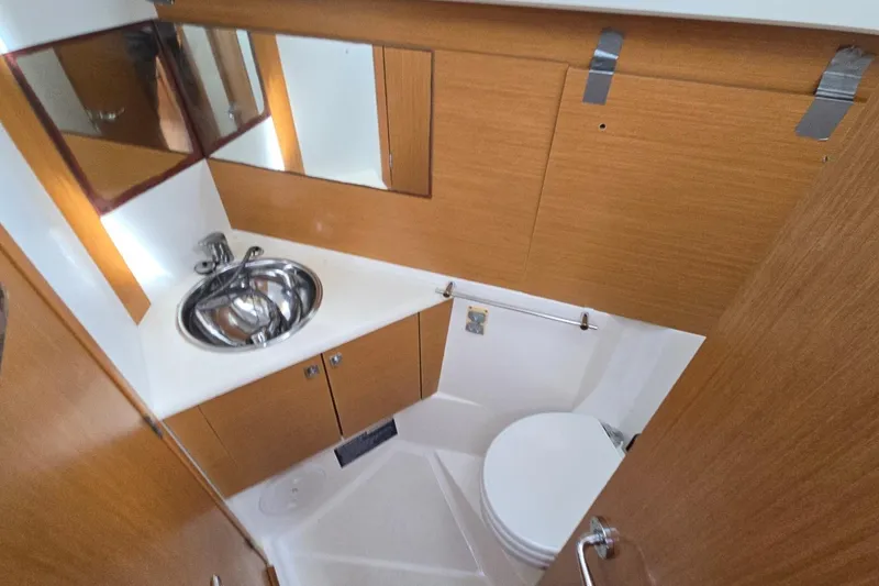 Slide: The Image of Bathroom interior of 2011 Jeanneau Sun Odyssey 50 DS yacht, featuring sink and toilet. - 74