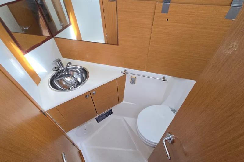 Slide: The Image of Bathroom interior of 2011 Jeanneau Sun Odyssey 50 DS yacht, featuring sink and toilet. - 75