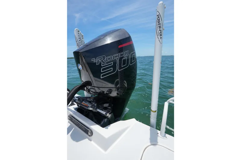 Slide: The Image of 2022 Shallow Sport 24 Modified V boat with powerful Racing 300 engine on open water. - 19