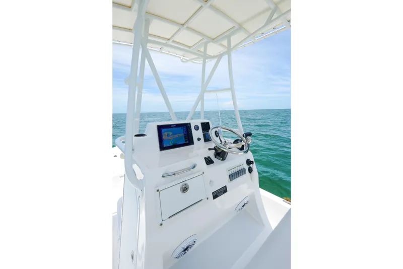 Slide: The Image of 2022 Shallow Sport 24 Modified V boat console with ocean view. - 6