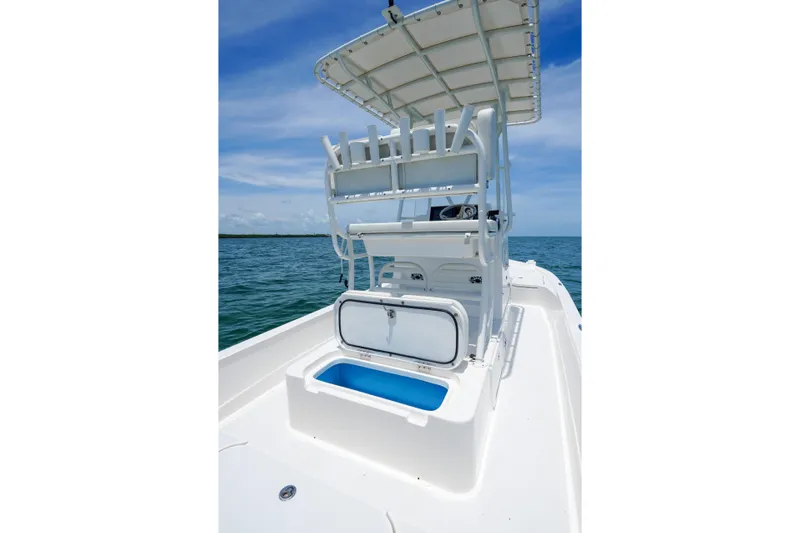 Slide: The Image of 2022 Shallow Sport 24 Modified V boat with open storage, ocean view. - 8