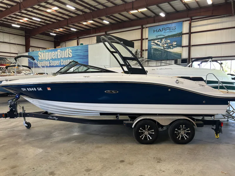 Slide: The Image of 2023 Sea Ray SPX 210 boat in a warehouse. - 1