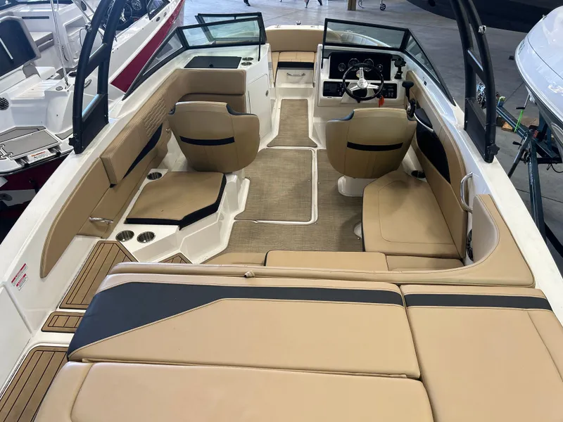Slide: The Image of Interior of a 2023 Sea Ray SPX 210 boat with beige seating. - 5