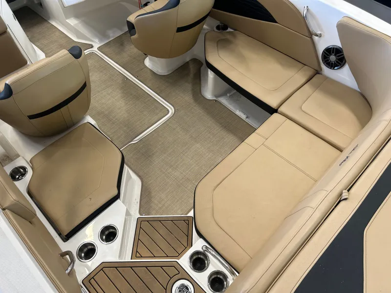 Slide: The Image of Interior of 2023 Sea Ray SPX 210 boat with beige seating. - 7