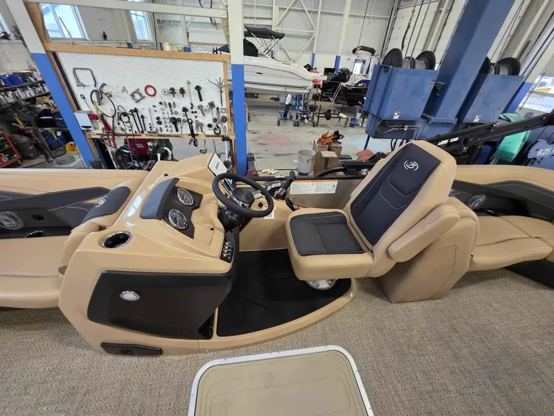 Slide: The Image of Interior view of Barletta Cabrio 22QC 2026 boat in a workshop. - 14