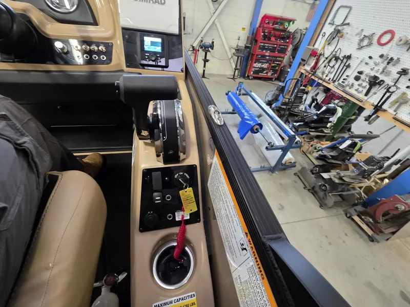 Slide: The Image of Interior view of a Barletta Cabrio 22QC boat in a workshop. - 15