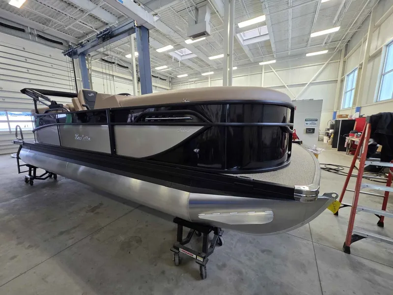 Slide: The Image of 2026 Barletta Cabrio 22QC pontoon boat in a workshop. - 2