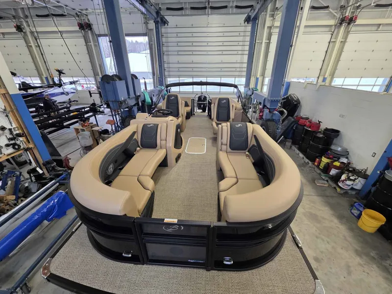 Slide: The Image of Interior view of 2026 Barletta Cabrio 22QC pontoon boat in a workshop. - 21