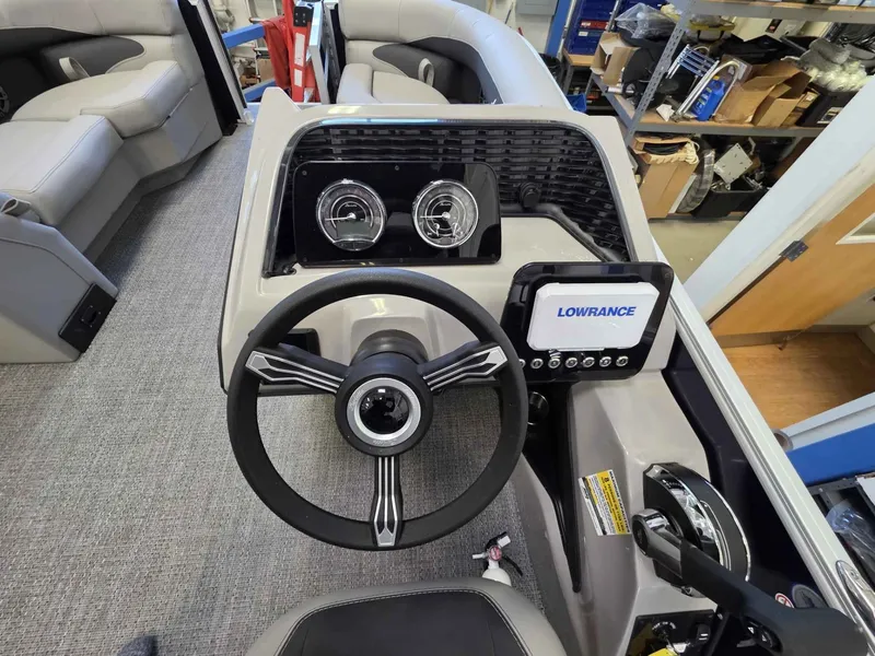 Slide: The Image of Interior view of 2026 Barletta ARIA 20UC helm with Lowrance display. - 12