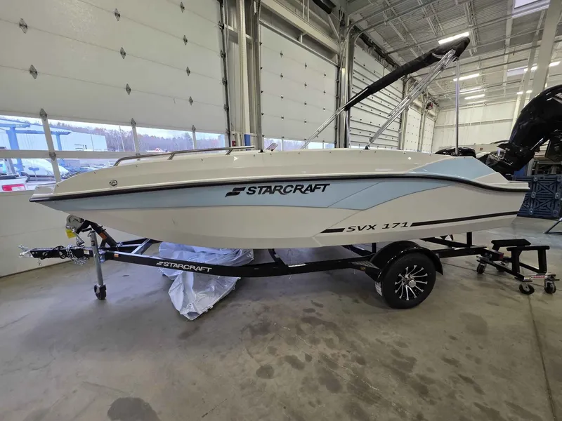 The Image of Starcraft SVX 171 OB 2026 boat in a warehouse. - 1