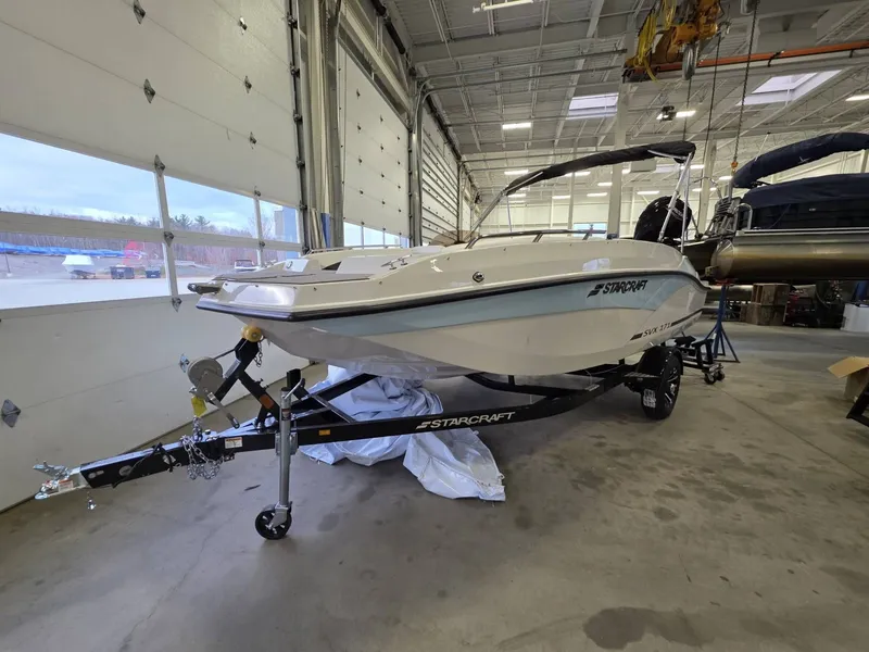 Slide: The Image of 2026 Starcraft SVX 171 OB boat on trailer in workshop. - 2