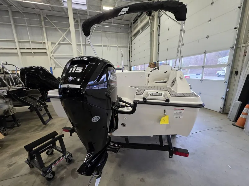 Slide: The Image of 2026 Starcraft SVX 171 OB with Mercury 115 engine in a workshop. - 6