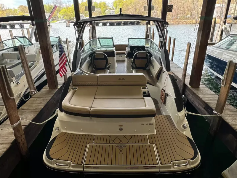 The Image of 2026 Sea Ray SLX 260 boat docked, showcasing luxury design. - 1