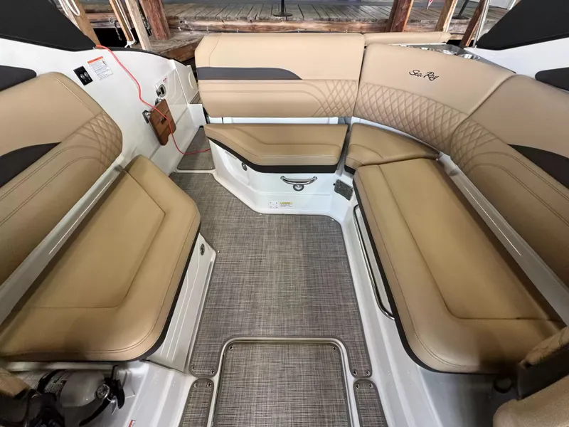 Slide: The Image of Interior of Sea Ray SLX 260 boat, 2026 model, featuring beige seating. - 7
