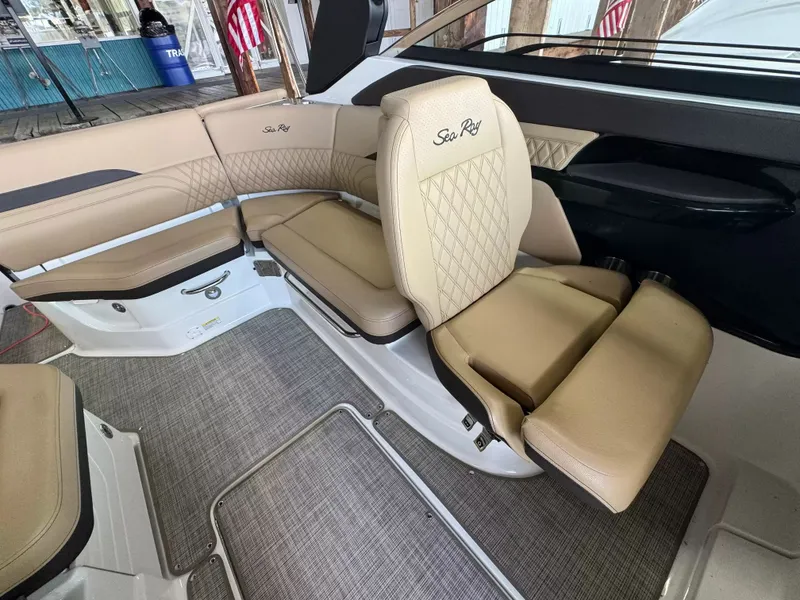 Slide: The Image of Interior of Sea Ray SLX 260 boat, beige leather seats, model year 2026. - 8