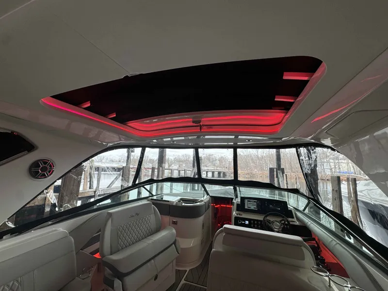 Slide: The Image of Interior of 2026 Sea Ray SLX 310 yacht with red lighting. - 11