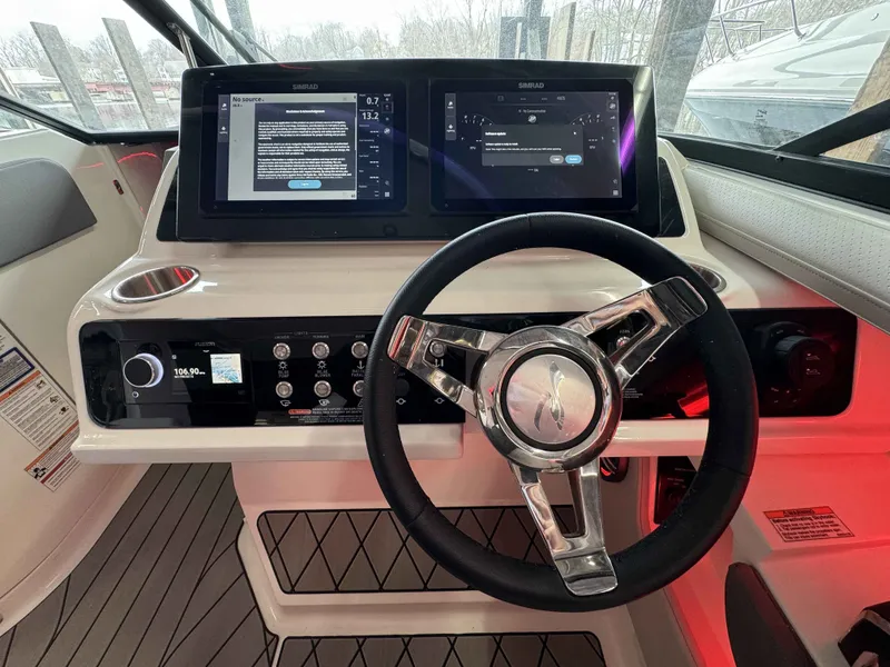 Slide: The Image of Sea Ray SLX 310 helm with modern displays, 2026 model. - 15