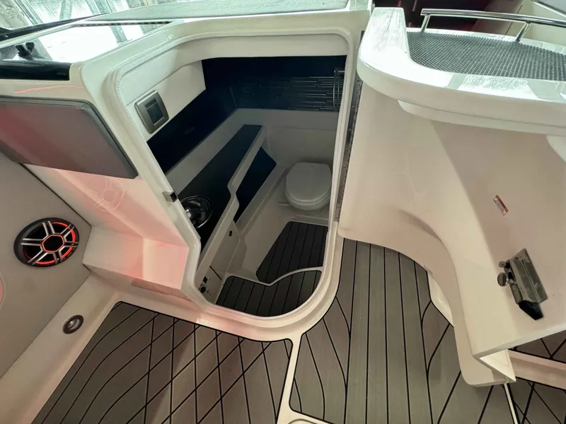 Slide: The Image of Interior of 2026 Sea Ray SLX 310 yacht with toilet and speaker. - 18