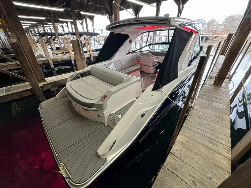 Slide: The Image of 2026 Sea Ray SLX 310 boat docked, showcasing luxury design. - 2