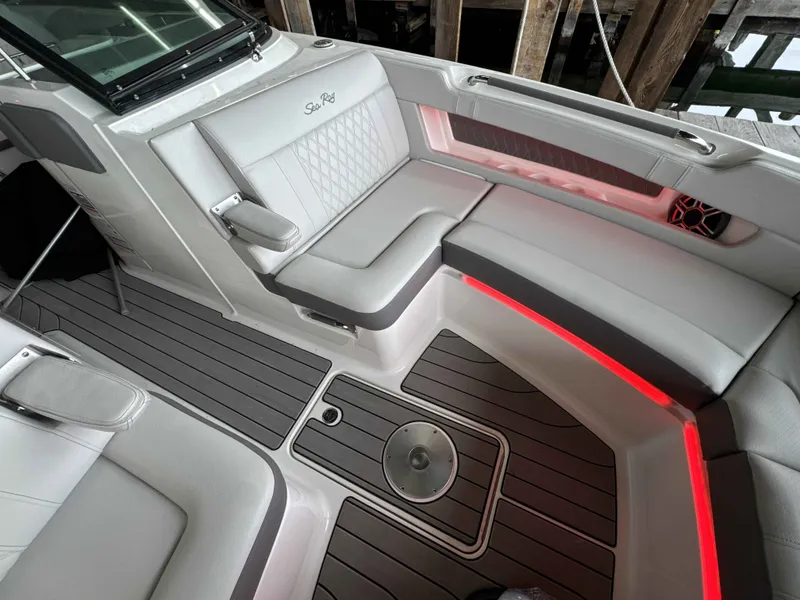 Slide: The Image of Interior of 2026 Sea Ray SLX 310 yacht with stylish seating area. - 24