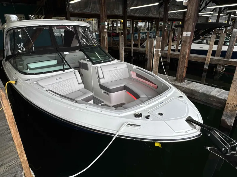 Slide: The Image of 2026 Sea Ray SLX 310 boat docked in marina. - 3
