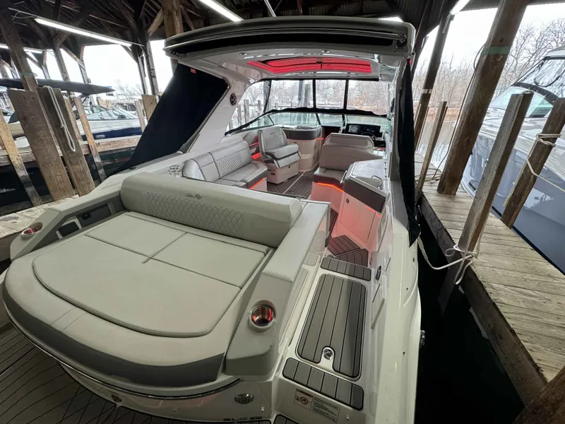 Slide: The Image of Interior of 2026 Sea Ray SLX 310 yacht with luxurious seating and design. - 5