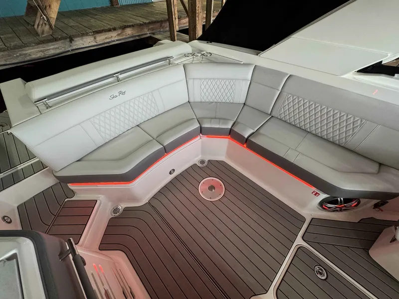 Slide: The Image of Interior of 2026 Sea Ray SLX 310 boat with gray upholstery. - 7
