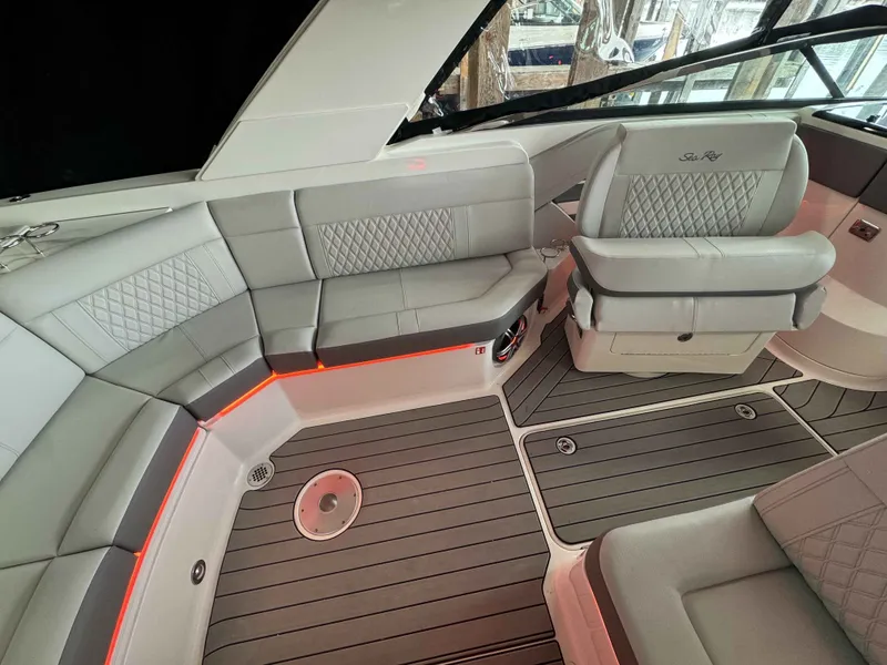 Slide: The Image of Interior of Sea Ray SLX 310 boat, luxurious seating, 2026 model. - 8