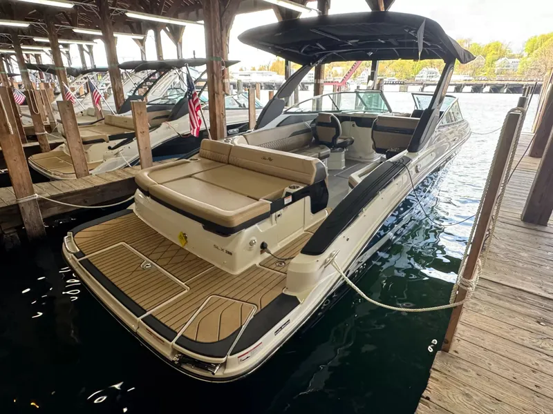 Slide: The Image of 2026 Sea Ray 280SLX motorboat docked in marina. - 4
