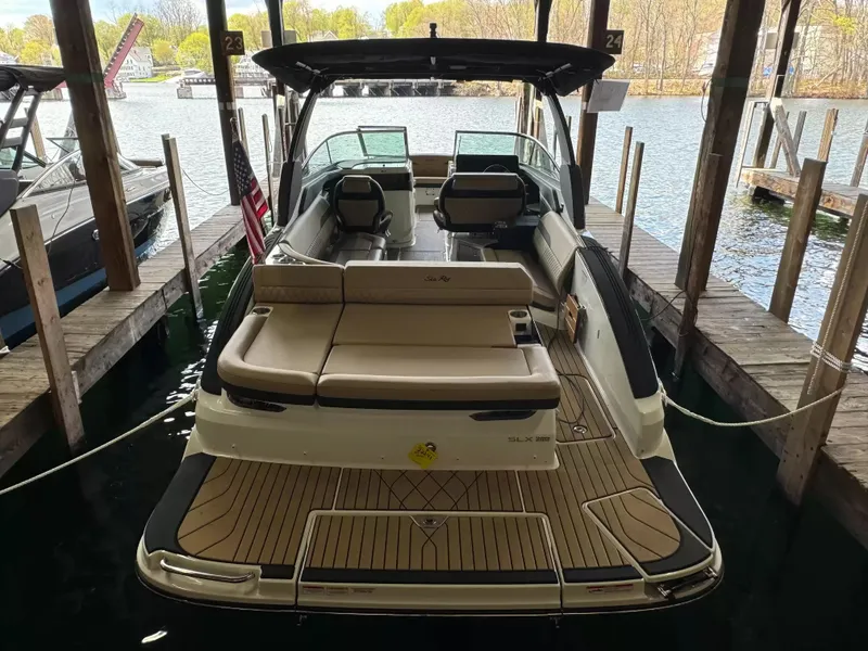 Slide: The Image of 2026 Sea Ray 280SLX boat docked, featuring sleek design. - 5