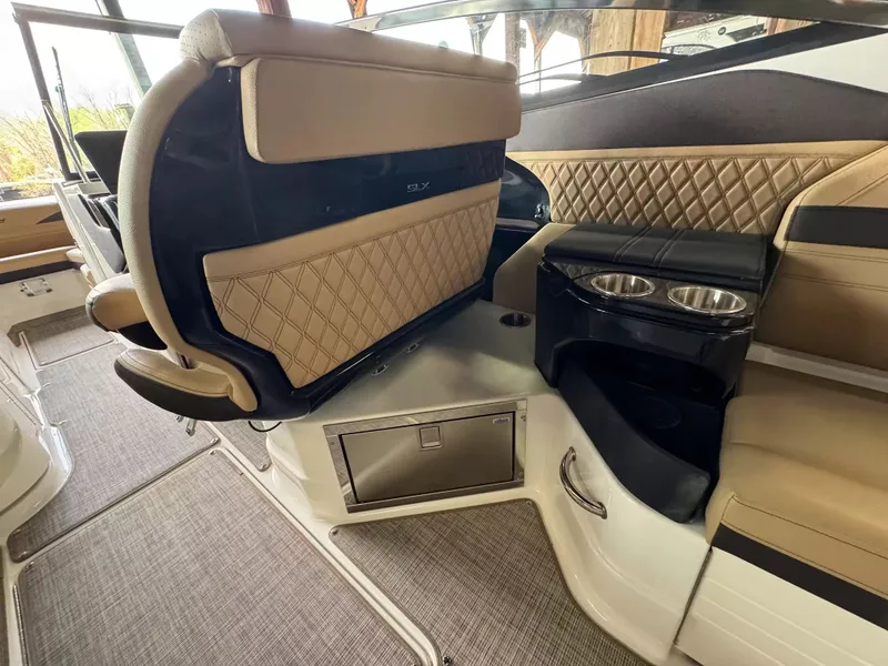 Slide: The Image of Interior of 2026 Sea Ray 280SLX with luxurious seating and cup holders. - 7