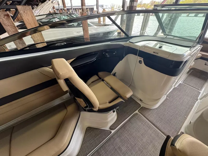 Slide: The Image of Interior of 2026 Sea Ray 280SLX with beige seating. - 8
