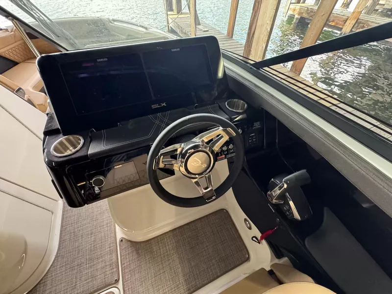 Slide: The Image of Interior view of 2026 Sea Ray 280SLX cockpit with modern controls. - 9