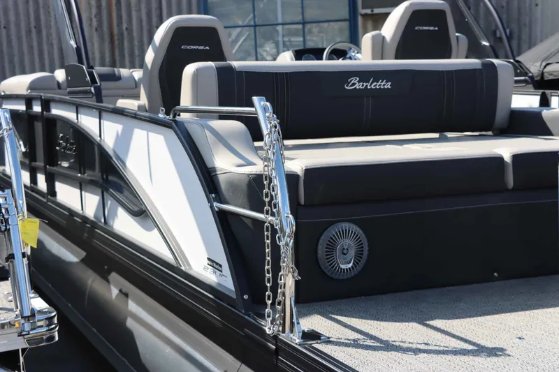 Slide: The Image of 2026 Barletta Corsa 23UC pontoon boat, side view with seating area. - 15