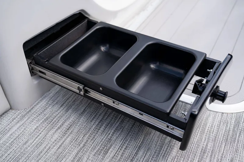 Slide: The Image of Barletta Corsa 23UC 2026, pull-out compartment with two black containers. - 6