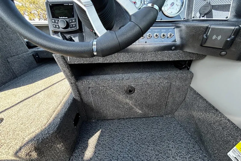 Slide: The Image of Interior view of 2026 Lund 1875 Crossover XS boat dashboard and steering wheel. - 10