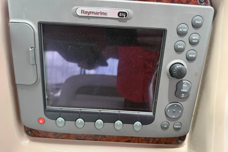 Slide: The Image of Raymarine E80 navigation system on 2006 Sea Ray Sundancer 320 boat dashboard. - 12